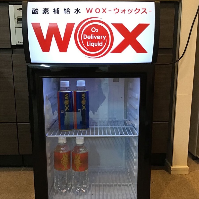 WOX bottles in a branded retail fridge